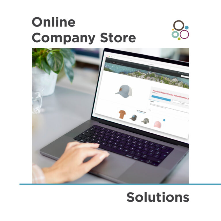 A person using a laptop with an online store interface displayed, showing various hats. A plant is on the table. The text reads "Online Company Store Solutions" with a small logo of overlapping circles.