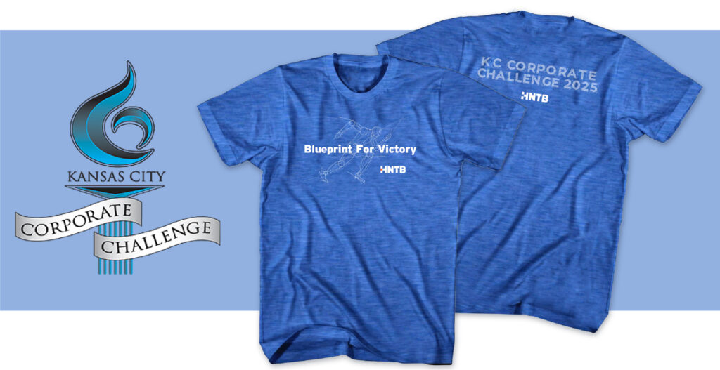 Two blue T-shirts read "Blueprint For Victory" and "KC Corporate Challenge 2025" with the NTTB logo. Beside them is the Kansas City Corporate Challenge logo with a blue flame and ribbon on a light blue background.